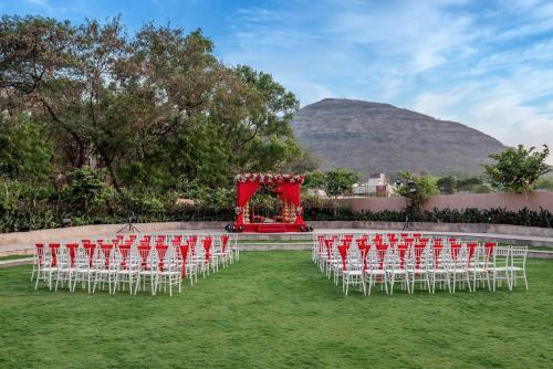 a row of chairs and a set up for a wedding at Radisson Blu Hotel & Spa, Nashik in Nashik