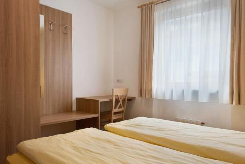 Una cama o camas en una habitación de Hilber App Furchetta