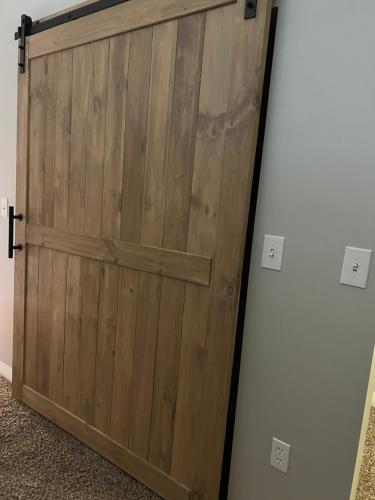 a sliding barn door in a room at Downtown Norfolk Loft in Norfolk