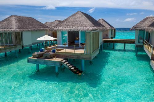 a resort on the water in the maldives at Baglioni Resort Maldives - Luxury All Inclusive in Dhaalu Atoll
