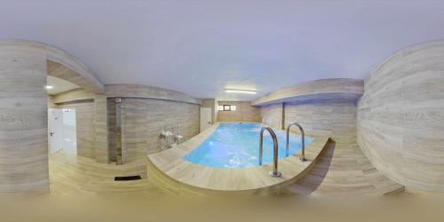 a swimming pool in a large room with a pool at Casa Rural Sierra Oeste in Madrid