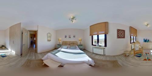 a large room with two beds in it at Casa Rural Sierra Oeste in Madrid