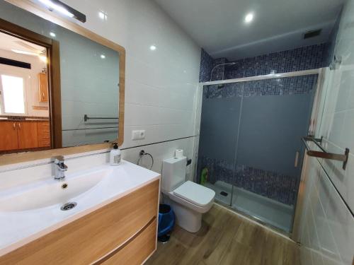 a bathroom with a sink and a toilet and a shower at Rico Apartaments Parador in Nerja