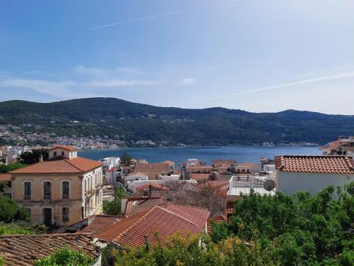 a view of a town with a lake in the background at Stonehouse with wonderful seaview in Samos