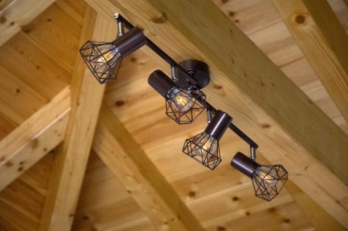 a group of lights hanging from the ceiling of a room at Stonehouse with wonderful seaview in Samos