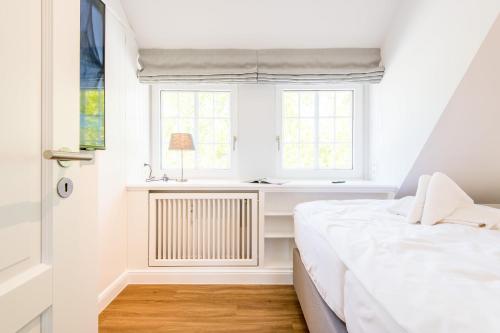 Postel nebo postele na pokoji v ubytování Haus Weesterhuk Whg 10