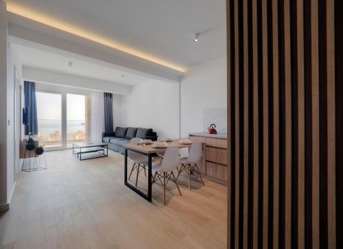 a living room with a couch and a table at Horizon-One bedroom apartment with pool Jane in Becici