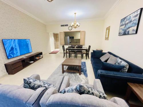 Телевизор и/или развлекательный центр в GOODWOOD SUITES HOMES VACATION