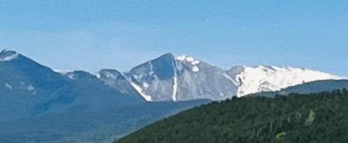 a snow covered mountain on top of a hill at Guest House Sofia in Sandanski