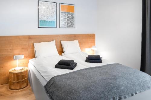 Baltique Apartment tesisinde bir odada yatak veya yataklar