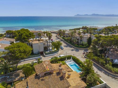 an aerial view of a resort with the ocean at Villa Plomer Serra in Playa de Muro