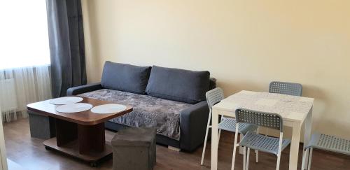 Posezení v ubytování Ventspilio apartamentai