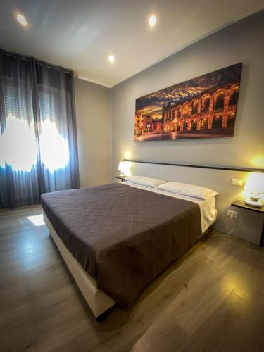 Postel nebo postele na pokoji v ubytování Hotel Arena