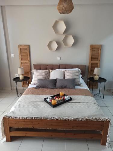 a tray of fruit on a bed in a bedroom at Kypseli studio rhodes in Kremasti