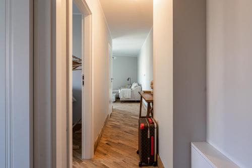 a hallway with a room with a suitcase in it at Apartamenty Przystanek Orłowo Centrum in Gdynia