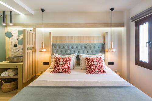 מיטה או מיטות בחדר ב-C Suites