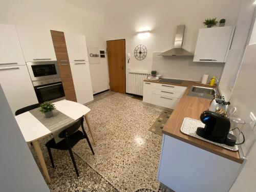 a kitchen with a table and a counter top at Albatros in Savona