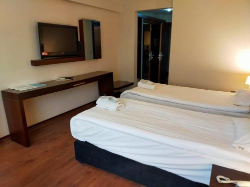 Ένα ή περισσότερα κρεβάτια σε δωμάτιο στο Tiara Thermal & SPA Hotel