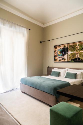 a bedroom with two beds and a large window at InCanto in Palermo