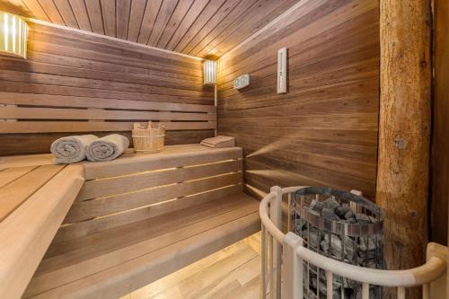 a sauna with wooden walls and wooden floors at La Ferme Francej Luxury Farmhouse Bohinj in Bohinjska Bistrica