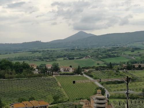 a view of a village in a valley with mountains at Casa di Laura in Chianciano Terme