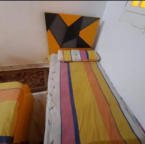 Postel nebo postele na pokoji v ubytování Aziza House