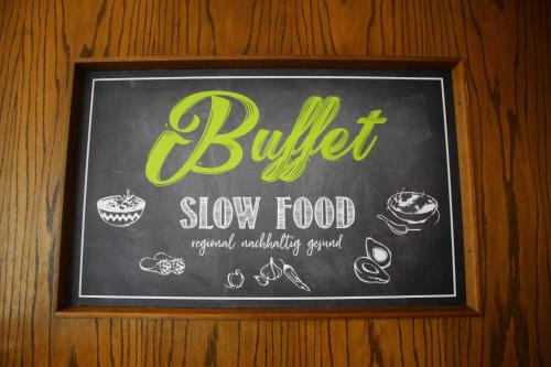 a chalkboard sign on a wall with food on it at Hotel Miriquidi All Inklusive in Kurort Oberwiesenthal