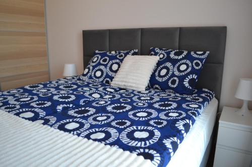 En eller flere senge i et værelse på Apartament Justynka
