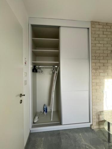 a shower in a bathroom with a glass door at SEA& SUN in H̱adera