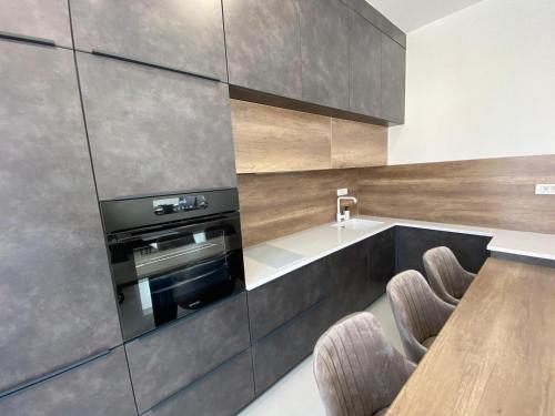 Kuchyňa alebo kuchynka v ubytovaní Apartman Emanuel