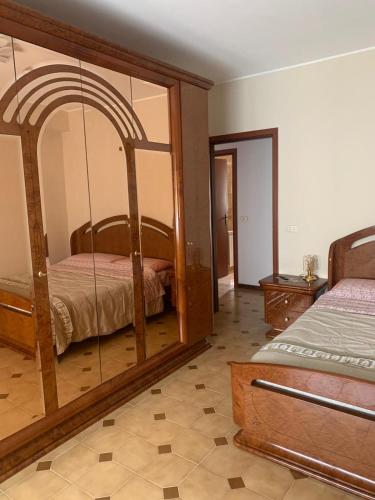 Posteľ alebo postele v izbe v ubytovaní Appartamento incantevole a pochi passi dal mare, Locazione breve turistica privata, no impresa
