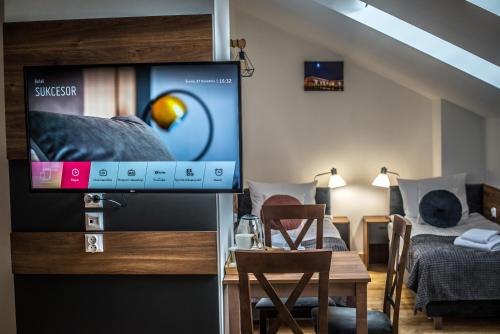 TV a/nebo společenská místnost v ubytování Hotel Sukcesor