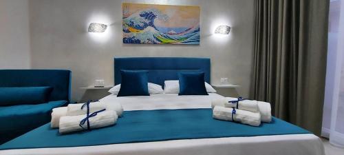 Postel nebo postele na pokoji v ubytování IL GIGLIO B&B