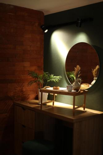 a mirror on top of a table in a room at Luxury Duplex Studios - City Center in Tbilisi City