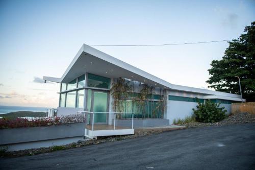 a large white building with a lot of windows at Happy Days Villa C in Fajardo