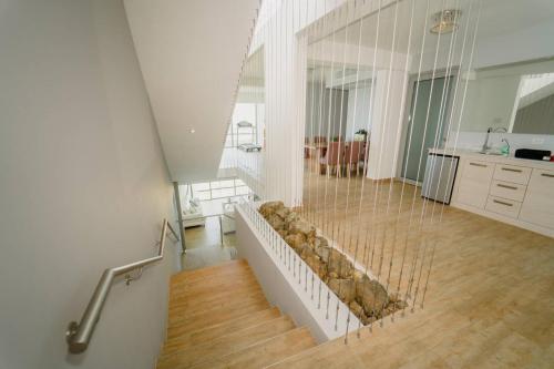 a room with a staircase with rocks inside of it at Happy Days Villa C in Fajardo