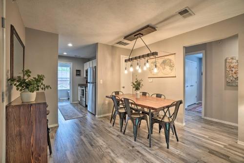 a dining room and kitchen with a table and chairs at Modern Condo with Deck about 7 Mi To Branson Landing! in Branson