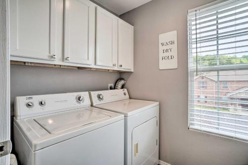 a white washer and dryer in a laundry room at Modern Condo with Pool about 7 Mi To Branson Landing! in Branson