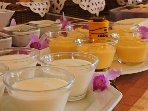 a tray of different types of candles on a table at Pousada Ouro de Minas in Tiradentes