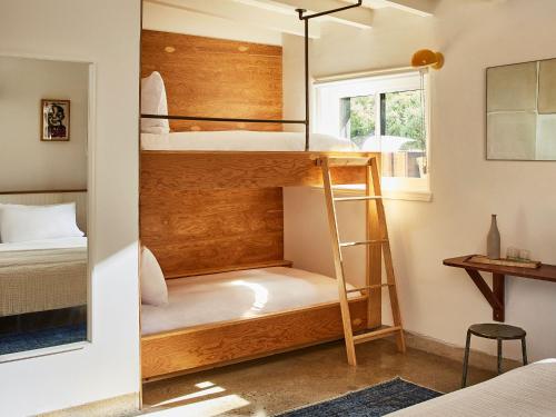 a bedroom with bunk beds in a tiny house at Hotel June Malibu in Malibu