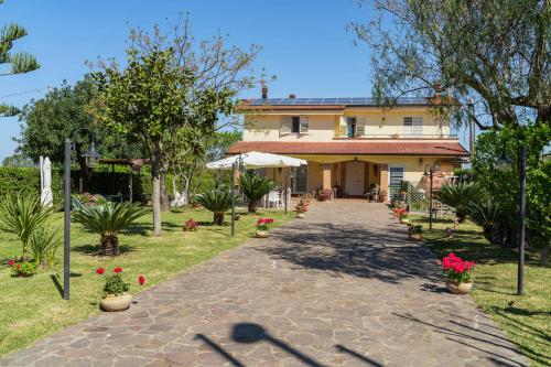 a house with a pathway in front of it at Villa Brunella in Agropoli