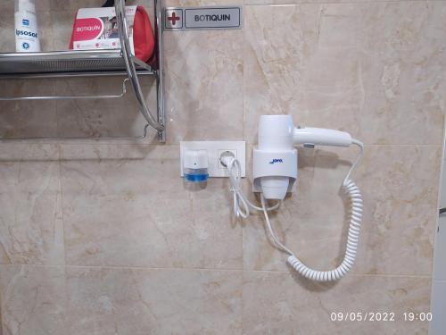 a phone on a wall in a bathroom at Piso Navas in Navas de San Antonio
