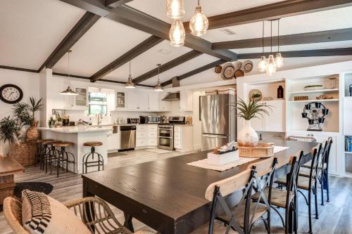 a kitchen with a large wooden table and chairs at S'more Fun in Middleburg