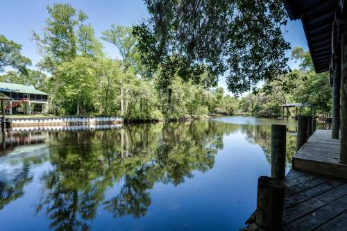 a view of a river with trees and a dock at S'more Fun in Middleburg