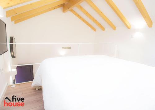 a living room with a white table in a house at FIVE HOUSE 20 in Porto