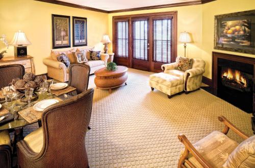 a living room filled with furniture and a fireplace at Club Wyndham Dye Villas in North Myrtle Beach