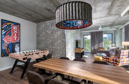 a living room with a ping pong table and a couch at Club Wyndham Austin in Austin