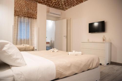 Krevet ili kreveti u jedinici u okviru objekta Aris Appartamento Torino