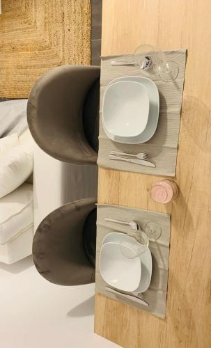 a collage of photos of a sink and mirrors at Elegant Apartment Keramoti in Keramoti