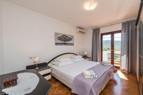 Ένα ή περισσότερα κρεβάτια σε δωμάτιο στο Stedi Apartment